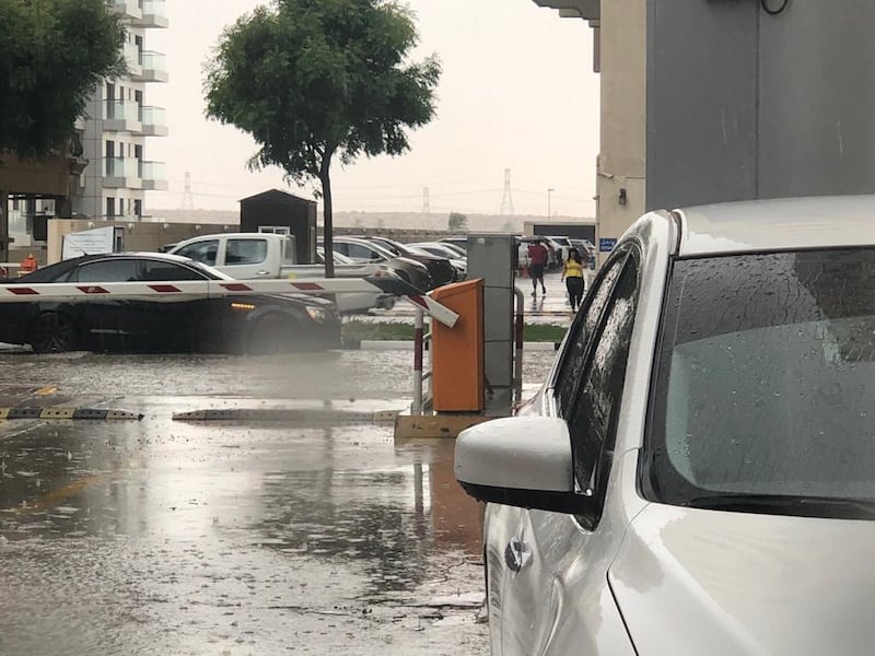 Rain floods the streets of Dubai near Silicon Oasis. The National