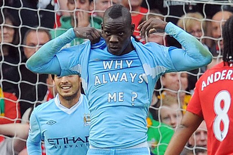 Mario Balotelli celebration style became a memorable moment and it came during a Manchester derby at Old Trafford in 2011. Andrew Yates / AFP