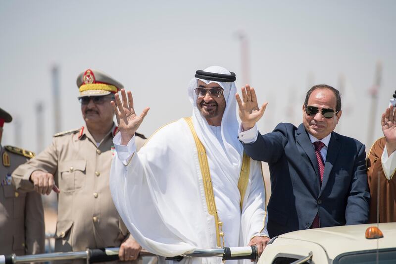 EL HAMAM, MATROUH GOVERNORATE, EGYPT - July 22, 2017: HH Sheikh Mohamed bin Zayed Al Nahyan Crown Prince of Abu Dhabi Deputy Supreme Commander of the UAE Armed Forces (C) and HE Abdel Fattah El Sisi, President of Egypt (R), inspect members of the Egyptian  Armed Forces during the inauguration of the Mohamed Naguib Military Base.

( Rashed Al Mansoori / Crown Prince Court - Abu Dhabi )
---