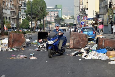 Lebanese anti-government protestors block a main road by garbage bins over deteriorating living conditions. Citizens fear a combination of rising unemployment, poverty, sectarian tensions, the devaluation of the Lebanese pound and Covid-19 disease may spark another conflict, three decades after a 15-year civil war. EPA