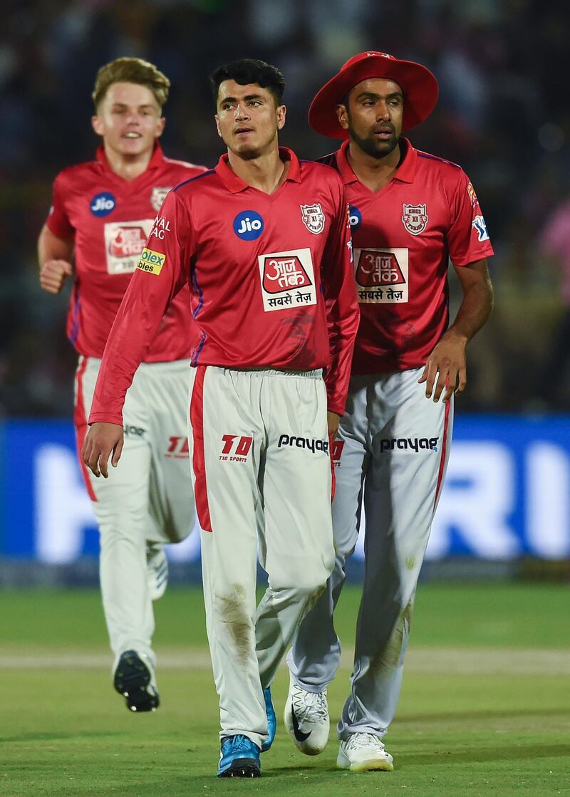 Kings XI Punjab's Mujeeb Ur Rahman (C) celebrates after dismissing Rajasthan Royals' Ben Stokes during the 2019 Indian Premier League (IPL) Twenty20 cricket match between Rajasthan Royals and Kings XI Punjab at the Sawai Mansingh stadium in Jaipur on March 25, 2019. (Photo by Money SHARMA / AFP) / IMAGE RESTRICTED TO EDITORIAL USE - STRICTLY NO COMMERCIAL USE