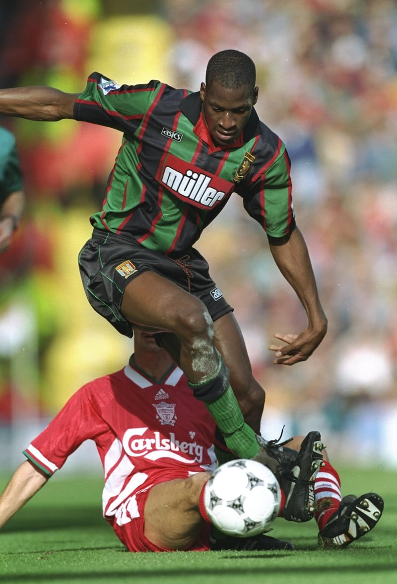 8 Oct 1994:  Ubo Ehiogu of Aston Villa is tackled during an FA Carling Premiership match against Liverpool at Anfield in Liverpool, England. \ Mandatory Credit: Mike  Hewitt/Allsport