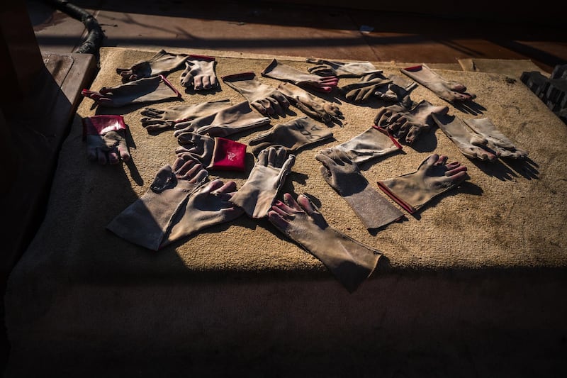 Workers’ gloves left to dry at Mina Zayed. Courtesy Sohail Karmani