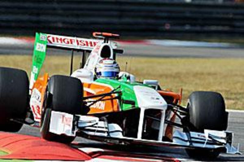 The German driver Adrian Sutil takes a corner in his Force India car on his way to a fourth-place finish in the Italian Grand Prix at Monza last year.