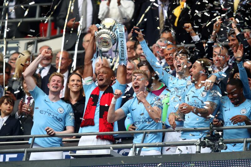 (FILE PHOTO) It has been reported on May 19, 2019 that Manchester City Captain Vincent Kompany is to leave after 11-Years at the club, during which the 33-year-old Belgium defender won four Premier League titles, two FA Cups and four League Cups, two Community Shields and scored 20 goals in 360 games. Saturdays FA Cup final was his last game, which saw City completed their history-making domestic treble. LONDON, ENGLAND - MAY 18: Vincent Kompany of Manchester City lifts the trophy following the FA Cup Final match between Manchester City and Watford at Wembley Stadium on May 18, 2019 in London, England. (Photo by Julian Finney/Getty Images)