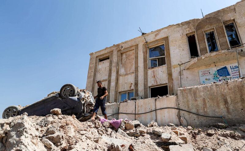 This picture shows a view outside a health facility that was hit by a reported Russian air strike after midnight in town of Urum al-Kubra in the western countryside of Syria's northern Aleppo province, just before a truce went into effect.  AFP