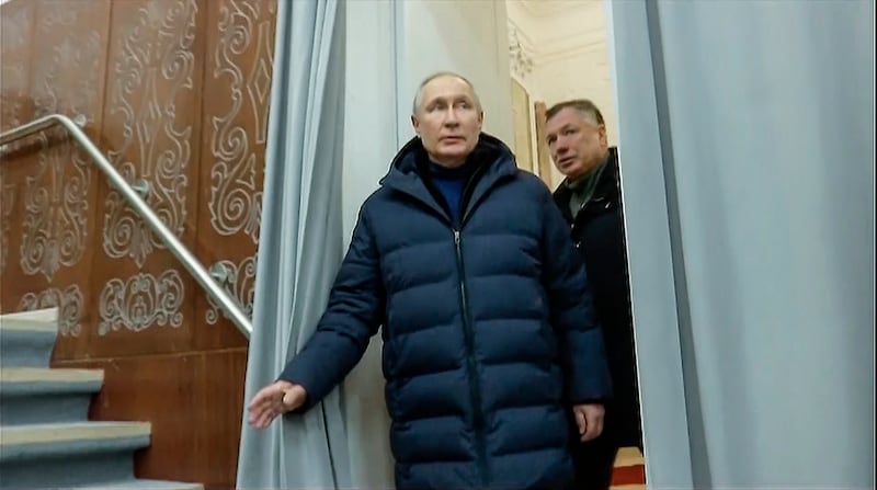 Russian President Vladimir Putin and Russian Deputy Prime Minister Marat Khusnullin visit the Mariupol drama theatre. AP