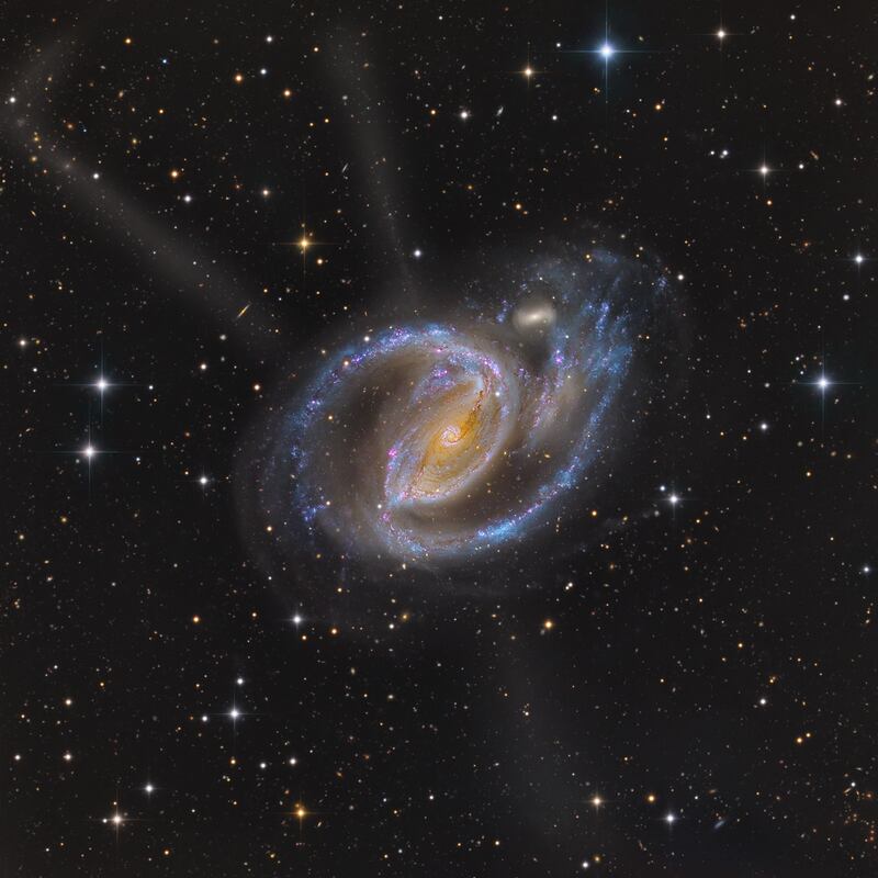 NGC 1097, a spiral galaxy 50 million light years from Earth. Photo: Mark Hanson and Mike Selby