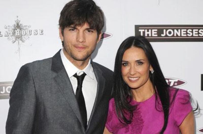 Ashton Kutcher and his wife Demi Moore are among the Twitter elite with almost five million people watching their tweets.