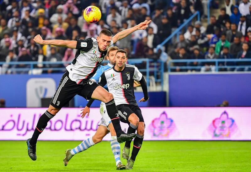 Juventus' Turkish defender Merih Demiral (L) heads the ball. AFP