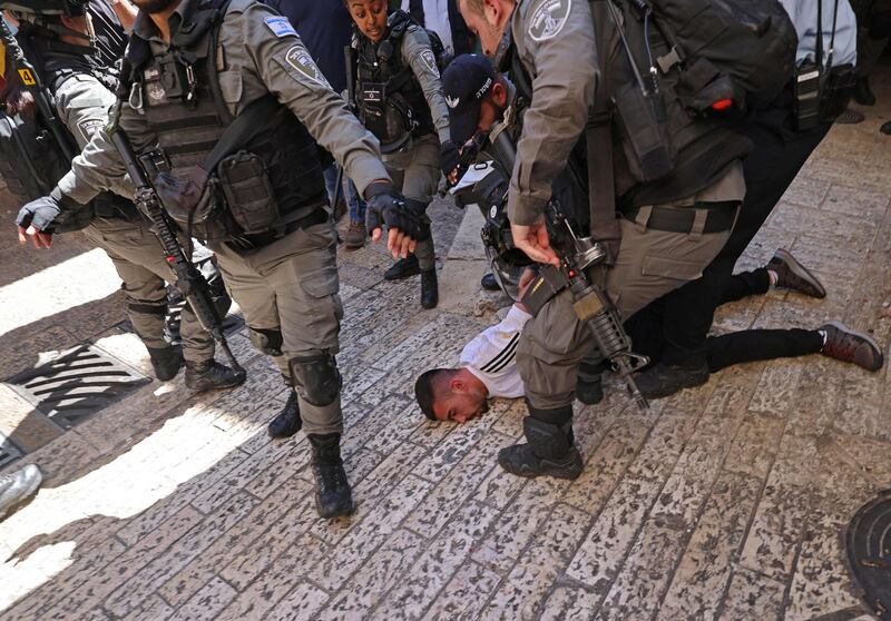 Israeli border police detain a Palestinian man during protests at Damascus Gate in East Jerusalem. AFP