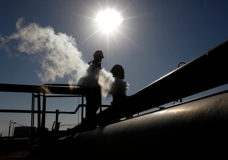 FILE - In this Feb. 26, 2011 file photo, a Libyan oil worker, works at a refinery inside the Brega oil complex, in Brega, eastern Libya.  ON Saturday, Jan. 18, 2020, the National Oil Corporation in Libya says that a decision by east-based forces to choke off oil exports from its territory has threatened to throttle much of the countryâ€™s oil production. Powerful tribal groups loyal to Gen. Khalifa Hifter, whose forces control much of eastern Libya, seized several large export terminals along the eastern coast as well as southern oil fields in a challenge to the rival U.N.-backed government based in Tripoli, which collects revenues from oil production. The move has ratcheted up tensions ahead of an international peace summit to end the civil war. (AP Photo/Hussein Malla, File)