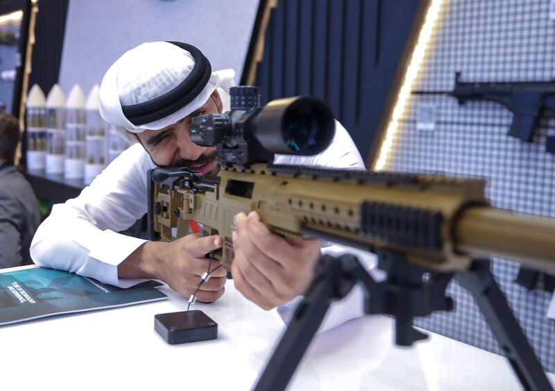 A visitor handles a calibre 7.62x51 rifle