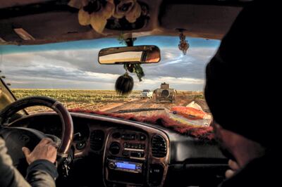 Driving through the desert in Syria's Deir Ezzour province, 7 March 2019. Campbell MacDiarmid