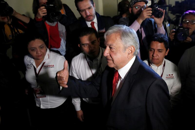 Andres Manuel Lopez Obrador, presidential pre-candidate of the National Regeneration Movement (MORENA), gestures while leaving an event after unveiling his security plan if he wins this year's election, in Mexico City, Mexico January 4, 2018. REUTERS/Carlos Jasso