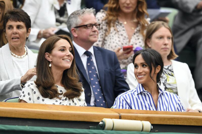 LONDON, ENGLAND - JULY 14:  Catherine, Duchess of Cambridge and Meghan, Duchess of Sussex attend day twelve of the Wimbledon Lawn Tennis Championships at All England Lawn Tennis and Croquet Club on July 14, 2018 in London, England.  (Photo by Clive Mason/Getty Images)