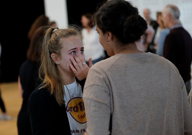 A student reacts after collecting her 'A' level exam results at Edgbaston High School for Girls in Birmingham, Britain August 17, 2017. REUTERS/Darren Staples