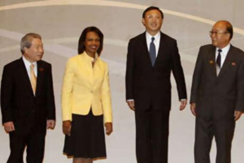 South Korea's foreign minister Yu Myung-hwan, the US Secretary of State Condoleezza Rice, China's foreign minister Yang Jeichi, and North Korea's foreign minister Pak Ui-chun pose before a meeting between foreign ministers of the six party nations and Ms Rice on the sidelines of the Association of Southeast Asian Nations (ASEAN) Regional Forum in Singapore.