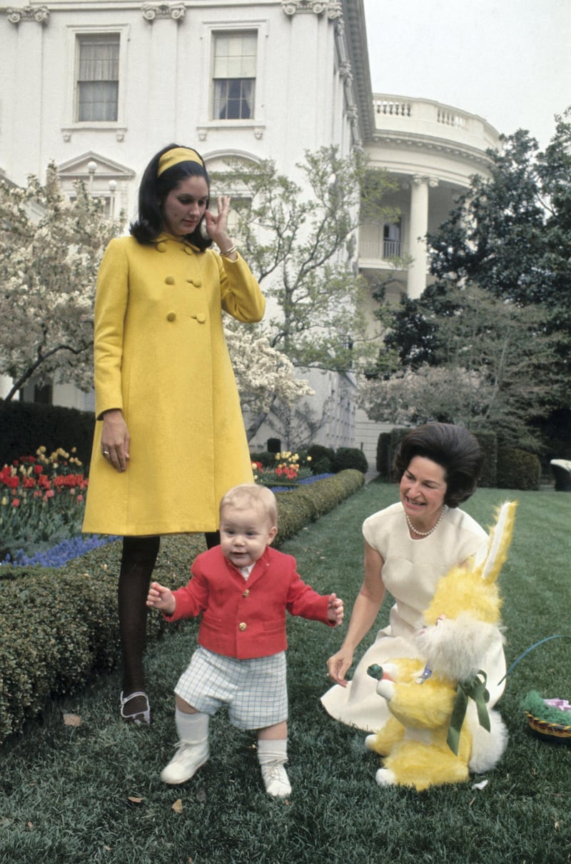 (Original Caption) Lady Bird Johnson is shown in the White House rose garden with her grandson Patrick Lyndon Nugent and an Easter Bunny. Lynda Bird Robb is also shown.