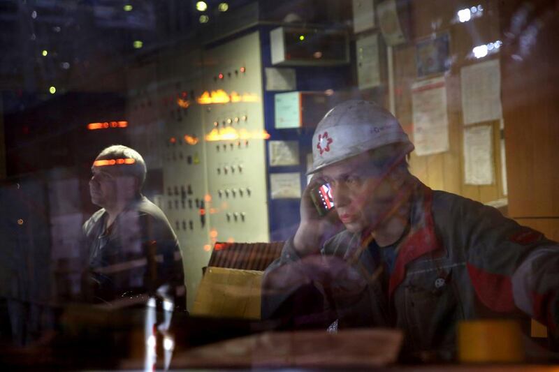 Employees work in a control room at the Ilyich Iron and Steel Works. Rinat Akhmetov, the owner of the factory and richest man in Ukraine, has enlisted his 300,000 employees to end the turmoil unleashed by the armed takeover of pro-Russian separatists in Mairupol. John Moore / Getty Images