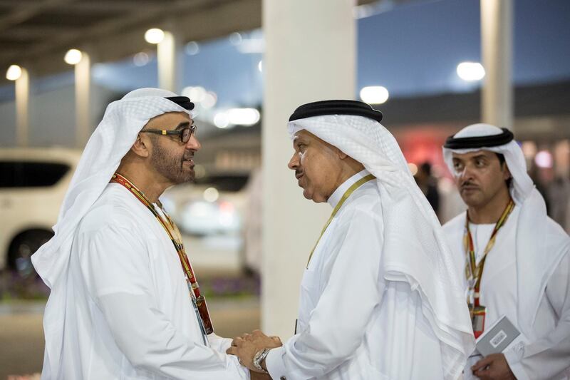 YAS ISLAND, ABU DHABI, UNITED ARAB EMIRATES - November 23, 2014: HH General Sheikh Mohamed bin Zayed Al Nahyan Crown Prince of Abu Dhabi and Deputy Supreme Commander of the UAE Armed Forces (L), bids farewell to Dr Abdullatif Al Zayani Secretary General of the Gulf Cooperation Council for the Arab States of the Gulf (R), after the final race of the 2014 Formula 1 Etihad Airways Abu Dhabi Grand Prix, at Yas Marina Circuit. Seen with HH Sheikh Hazza bin Zayed Al Nahyan National Security Advisor for the United Arab Emirates and Vice Chairman of the Abu Dhabi Executive Council (back R). 
( Ryan Carter / Crown Prince Court - Abu Dhabi )