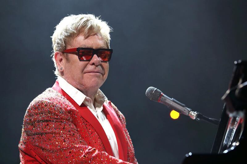 Elton John performs at Barclays Center in New York. The singer has postponed his Dubai concert for the second time. Greg Allen / Invision / AP