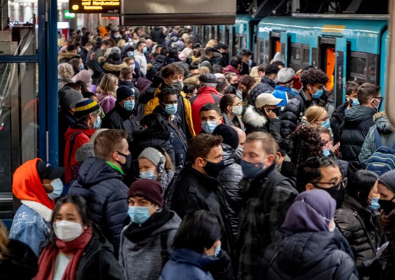 People wait for a subway train in Frankfurt, Germany. AP Photo