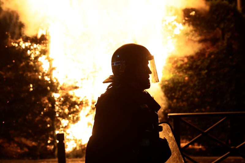 A French riot officer during a third night of violence over the police shooting of a 17-year-old in Nanterre. AP