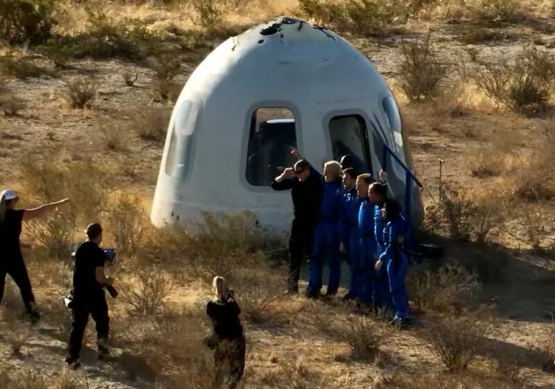 The crew exit the capsule after the successful suborbital flight.