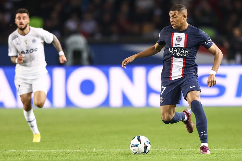 Marseille's Jonathan Clauss and Paris Saint-Germain's Kylian Mbappe in action. EPA