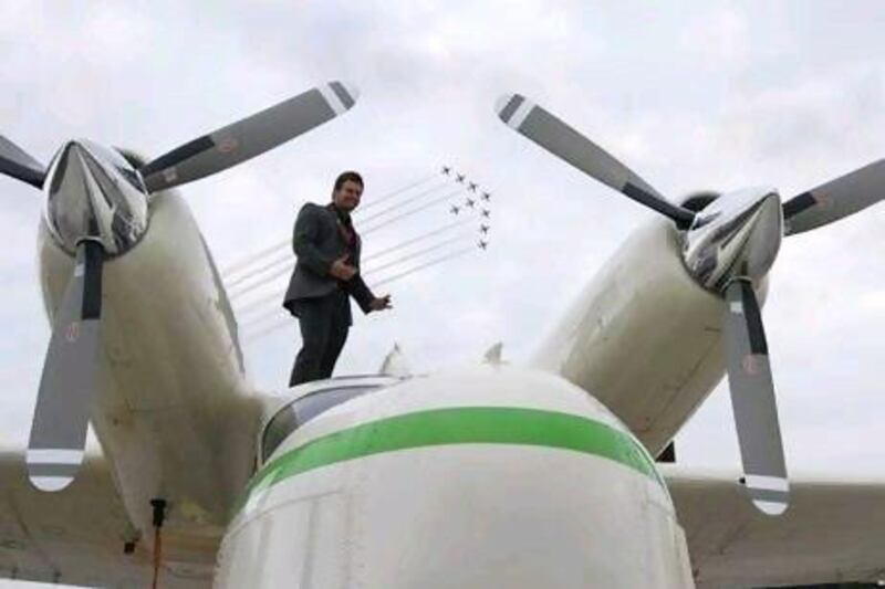 Joshua Hucklebridge, one of the Americans killed in a plane crash in Al Ain last year, poses with the rare seaplane at the London Air Show in 2010.