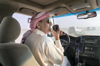 DUBAI, UNITED ARAB EMIRATES - DEC 3, 2017

Ahmed Bin Dhahi, communicates with his jockey, at the third edition of the National Day Camel Marathon. Organised by the Hamdan Bin Mohammed Heritage Centre, HHC, in co-operation with the Dubai Camel Racing Club, celebrates UAE’s 46th National Day, at Dubai International Endurance City, Saih Al Salam.

(Photo by Reem Mohammed/The National)

Reporter:  ANNA ZACHARIAS
Section: NA