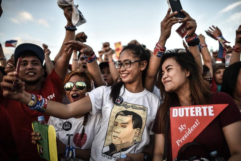 Supporters of Rodrigo Duterte take 'selfies' at an election campaign rally ahead of the Philippine presidential elections in Manila earlier this month. Duterte won the vote in a landslide victory. Mohd Rasfan / AFP.