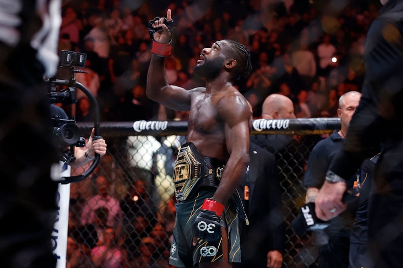 Aljamain Sterling celebrates his victory over Henry Cejudo after their bantamweight title bout at UFC 288. Getty