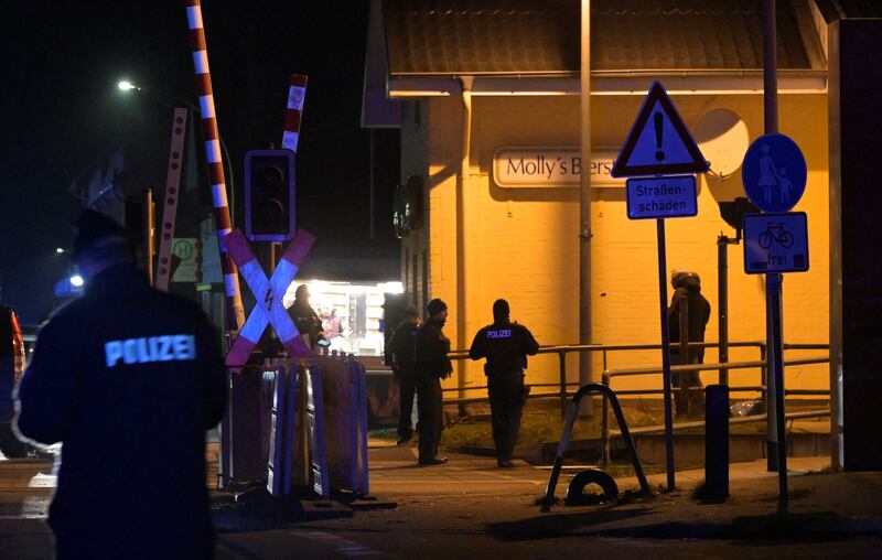 Police officers at the railway station after the knife attack. Reuters