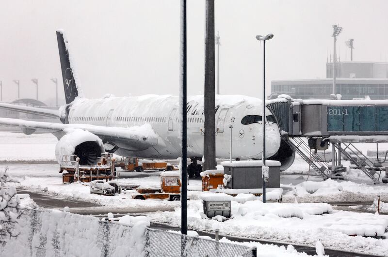 A Lufthansa aircraft is parked at the snow-covered Munich airport after all flights were cancelled on Saturday following a winter storm. AP