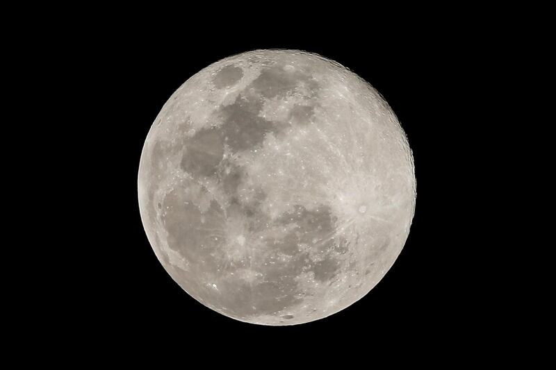 A close-up of the supermoon as it rises in the night sky over the Philippines' capital Manila. EPA