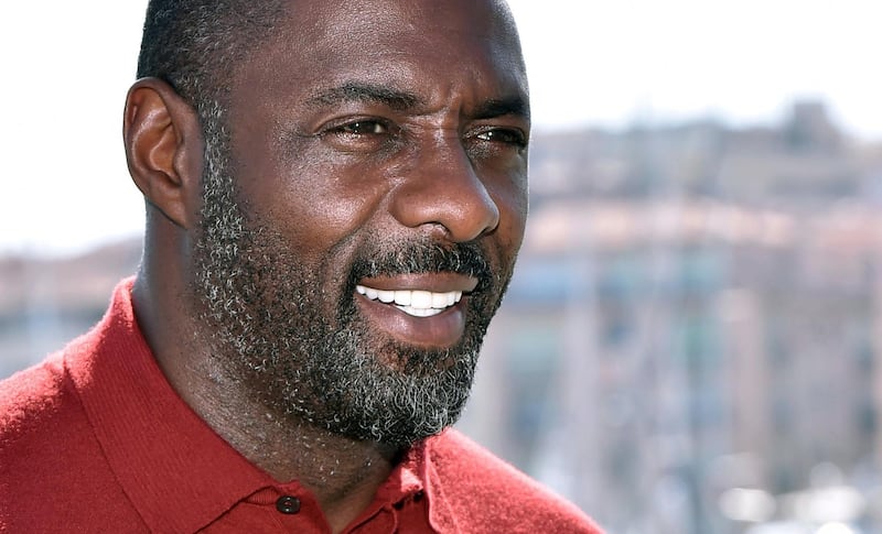 FILE - In this file photo dated Tuesday, April 14, 2015, actor Idris Elba poses for photographers during the MIPTV, International Television Programme Market, in Cannes, southern France.  British actor Idris Elba has stoked speculation he may take over the role of James Bond when Daniel Craig steps aside, offering an enigmatic Twitter post Sunday Aug. 12, 2018, saying "my name's Elba, Idris Elba,â€™â€™ fuelling the buzz about him becoming the first black Bond. (AP Photo/FILE)