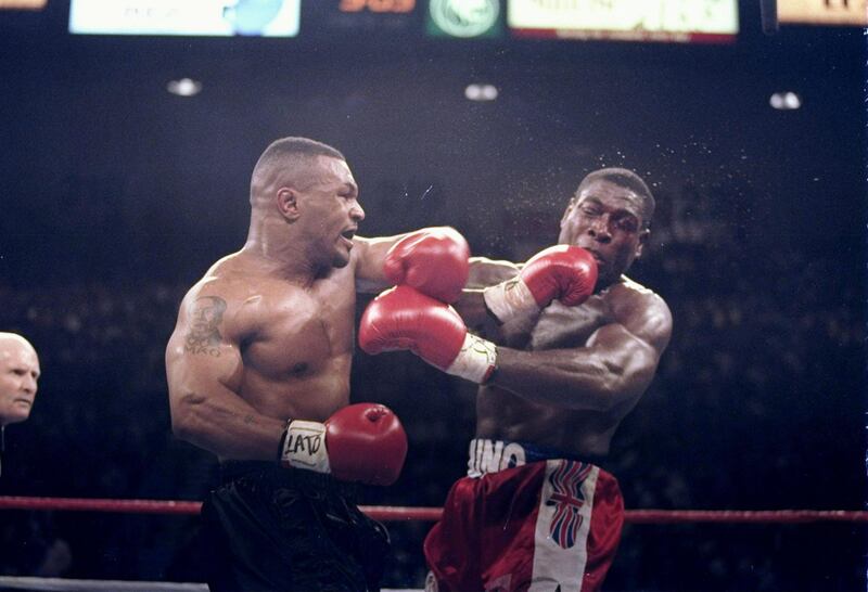 LAS VEGAS - MARCH 16:  (FILE PHOTO) Mike Tyson lands a left on Frank Bruno of Great Britain in the second round of the WBC Heavyweight Championship bout at the MGM Grand Garden on March 16, 1996 in Las Vegas, Nevada.  On September 22, 2003, the former world heavyweight boxing champion was taken to psychiatric hospital for treatment.  It has been reported that Bruno was seeking help for depression as he struggled to come to terms with life outside the ring and a divorce.  (Photo by Al Bello/Getty Images)