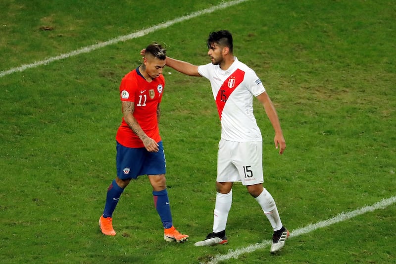 Peru's Carlos Zambrano (R) comforts Chile's Eduardo Vargas during the Copa America 2019 semi-finals soccer match between Chile and Peru, at Arena do Gremio Stadium in Porto Alegre, Brazil.  EPA