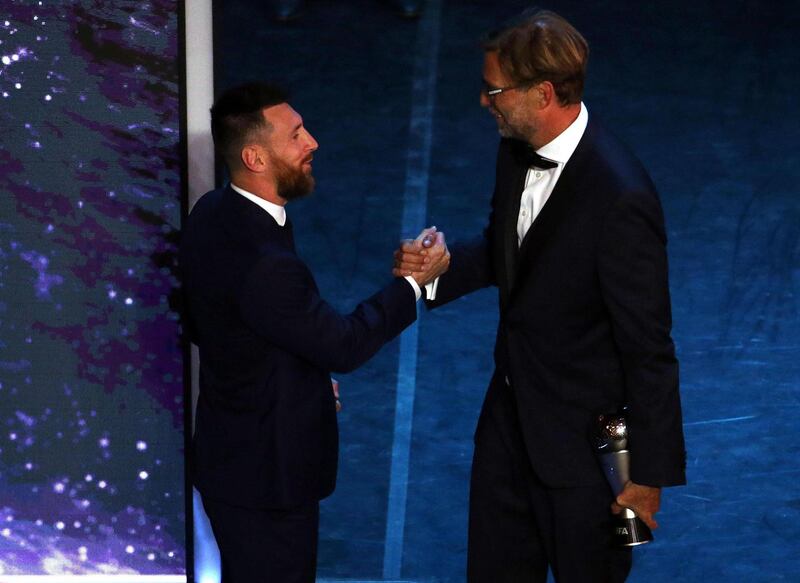 Argentinian player Lionel Messi and Liverpool manager Jurgen Klopp shake hands.  EPA