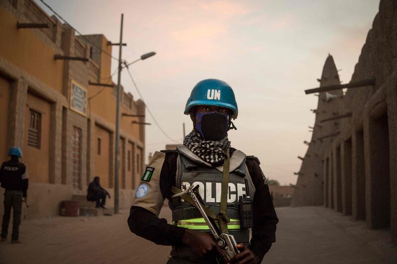 Policemen of the UN Stabilisation Mission in Mali (Minusma), patrol in front on the Great Mosque in Timbuktu. AFP