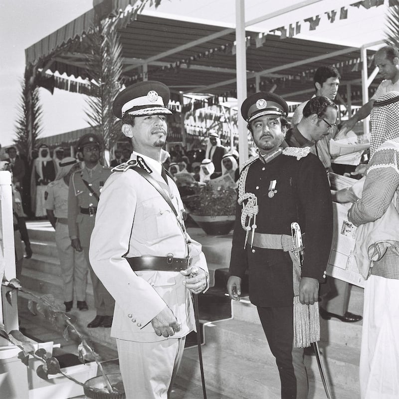 History Project 2010, "The First Day". Image from Al Itihad Union day collection . Abu Dhabi UAE. November 28 1971. 9.45am-1.30pm "Accession Day" Day 1. Sheikh Zayed Al Nahyan and dignitaries watch a parade from a 'celebration platform on Corniche Street near the ministry of education building' (Source Accession Celebration programme) In this photograph: Right, Sheikh Khalifa (dark uniform) 