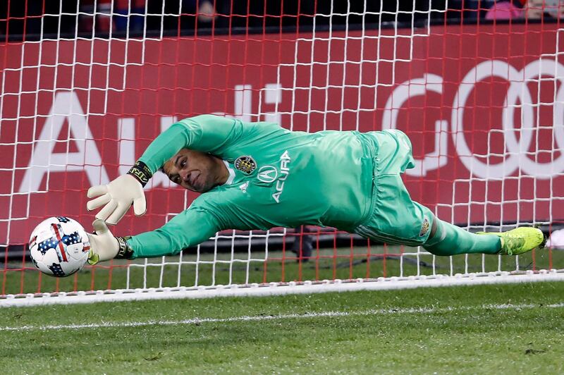 FILE - In this Nov. 29, 2017, file photo, Columbus Crew goalkeeper Zack Steffen makes a save on a penalty kick from Toronto FC midfielder Victor Vazquez, not shown, during the first half of an Eastern Conference MLS final playoff soccer game in Toronto. American goalkeeper Zack Steffen will transfer to Manchester City from the Columbus Crew in July. The Crew said Tuesday, Dec. 11, 2018, that Steffen will join City when the summer transfer window opens July 9.(Mark Blinch/The Canadian Press via AP, File)