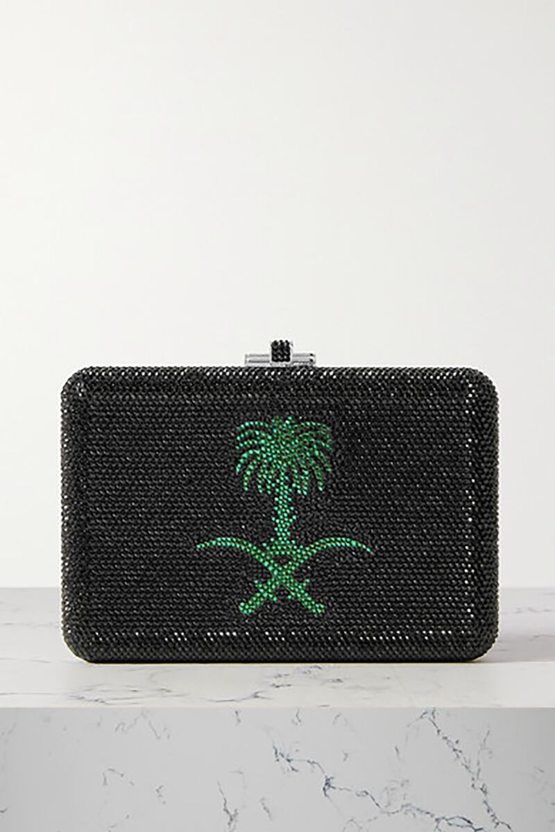To depict the Kingdom of Saudi Arabia, Judith Leiber chose to use the simplified logo of a palm and crossed swords. Courtesy Net A Porter