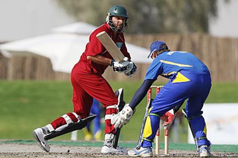 Shahid Afridi of Fly Emirates, in red, bats against the Cape Cobras in Dubai yesterday.