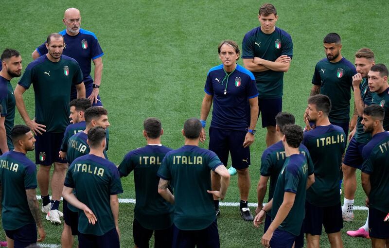 Italy coach Roberto Mancini speaks to his team. Getty