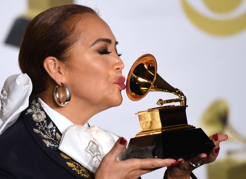 Recording artist Aida Cuevas, winner of the Best Regional Mexican Music Album (Including Tejano) award for 'Arrieros Somos ? Sesiones Acústicas,' poses in the press room. AFP