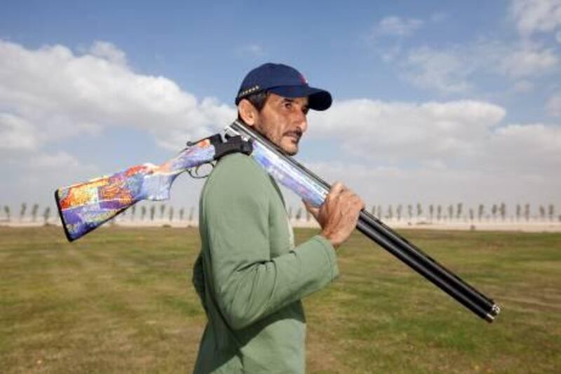 UAE - Dubai - Jan 24 - 2012: Ahmed bin Hashar Maktoun pose for a portrait with his rifle at Nedasheeba Shooting club. ( Jaime Puebla - The National Newspaper )