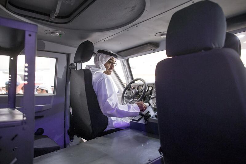 Sheikh Mohammed looks at a Nimr military vehicle at the Tawazun stand. Ryan Carter / Crown Prince Court - Abu Dhabi